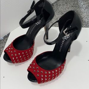 Red spiked high heels